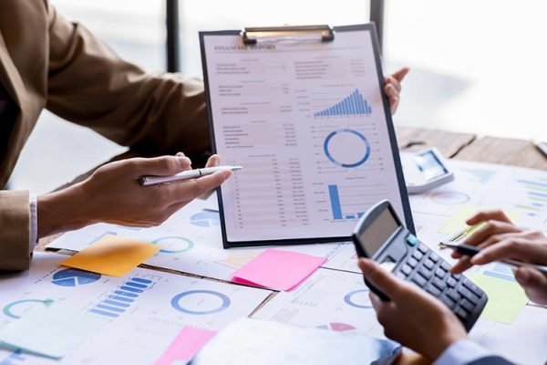 Brisbane based financial advisor showing reports in a consultation