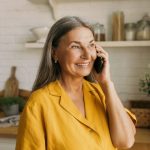 Retired Australian woman on the phone talking about age pension